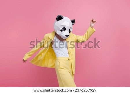 Portrait of elegant excited 3d panda mask girl dancing chilling nightclub event isolated on pink color background