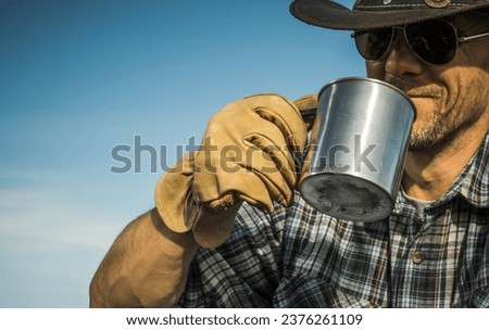 Happy Caucasian Cowboy in His 40s Drinking Hot Coffee From His Metal Made Cap