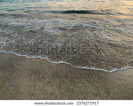 Waves crashing on the shoreline of Kelan Beach, Benoa, Bali. This photo taken with high angel.