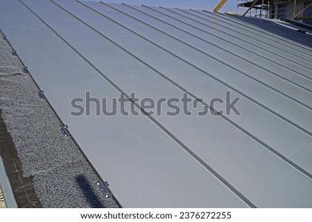 Roofing of terraced houses with standing seam roofing Royalty-Free Stock Photo #2376272255