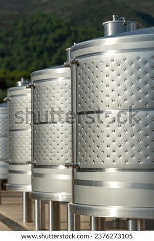 Industrial tanks of wine storage, exterior of a wine cellar. - stock photo