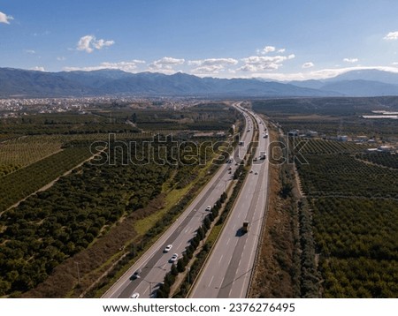 An aerial view of winding road to city Hatay Antakya surrounded by mountains Royalty-Free Stock Photo #2376276495
