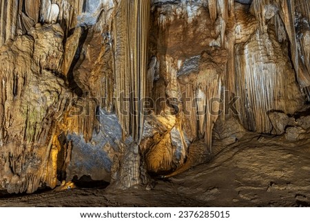Stalagmite and stalactite formation in the Paradise cave in Vietnam Royalty-Free Stock Photo #2376285015