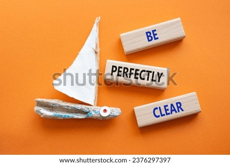 Be perfectly clear symbol. Concept words Be perfectlyclear on wooden blocks. Beautiful orange background with boat. Business and Be perfectly clear concept. Copy space Royalty-Free Stock Photo #2376297397