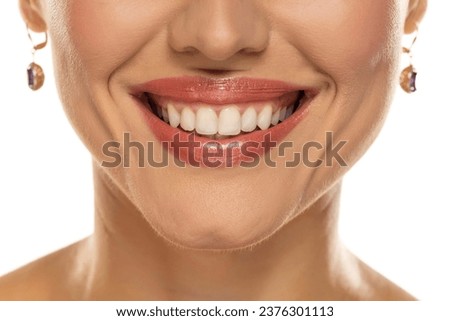 Close-up of a woman's mouth, capturing a confident smile and perfect natural teeth and lips Royalty-Free Stock Photo #2376301113