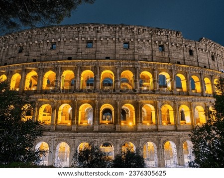 Colosseum illuminated facade at night. Rome, Italy