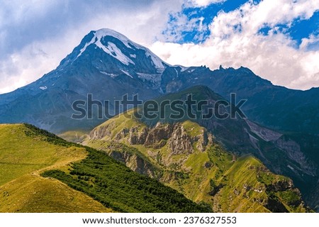Georgia.View of the Caucasus Mountains.Clouds over Kazbek.Snow on the top of the mountain.Copy space.