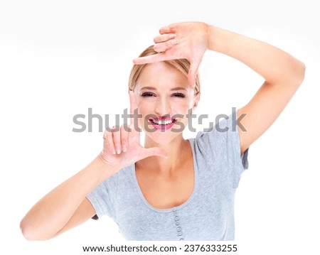 Portrait, woman and finger frame for face to review creative profile picture on white background in studio. Happy model check perspective for photography ideas, planning selfie or border of hand sign