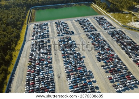 Aerial view of auction reseller company big parking lot with parked cars ready for remarketing services. Sales of secondhand vehicles Royalty-Free Stock Photo #2376338685