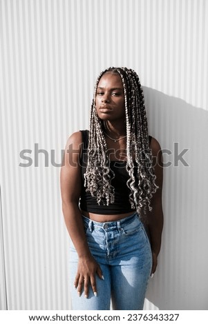  Stylish woman with a braids on white background