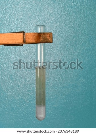 The presence of reducing sugars is indicated by the appearance of reddish-brown precipitate in test tubes. Royalty-Free Stock Photo #2376348189