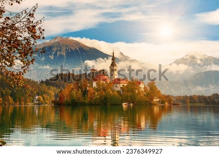 Church of Assumption in Lake Bled, Slovenia with blue sky and clouds in the autumn Royalty-Free Stock Photo #2376349927