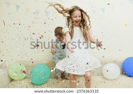 Confetti rain on a birthday Royalty-Free Stock Photo #2376363135