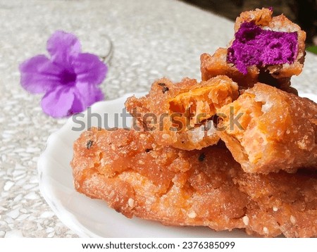 Snacks, desserts, fried potatoes, fried sweet potatoes, fried banana style, crispy, sweet, delicious. For background with copy space.