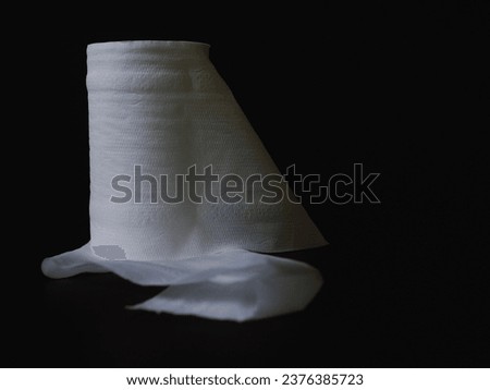 Toilet paper on a black background