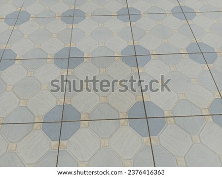 Floor tiles with octagonal motifs
