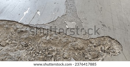 concrete surface damage and degradation due to high cyclic loads in a factory floor in san francisco california on October 2023 Royalty-Free Stock Photo #2376417885