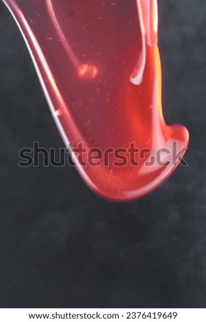 water splash of liquid berwarna orange kemerahan, very suitable for digital imaging of fruit juice drinks