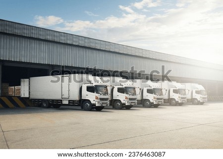 Container Trucks Parked Loading Package Boxes at Dock Warehouse. Cargo Container. Distribution Warehouse Shipping. Supply Chain, Shipment Boxes. Freight Truck Logistics, Cargo Transport. Royalty-Free Stock Photo #2376463087