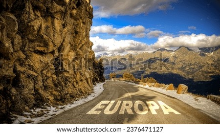 picture shows a signpost and a sign pointing towards Europe in German.