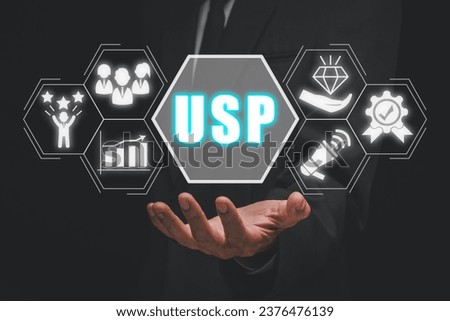 USP, Unique Selling Proposition concept, Businessman hand holding Unique Selling Proposition icon on virtual screen. Royalty-Free Stock Photo #2376476139