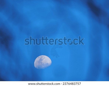 a moon with blue sky 