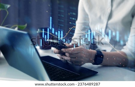 Trader analyzing data on virtual screen.Price graph and indicator. Stock market invest and crypto currency. Stock market and business investment.	