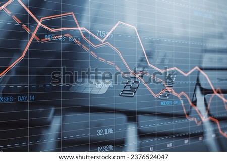 Close up of laptop keyboard with bank card and glowing downward red forex chart on blurry background. Crisis, and stock market fall concept. Double exposure