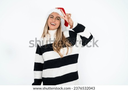 Young beautiful woman Doing peace symbol with fingers over face, smiling cheerful showing victory