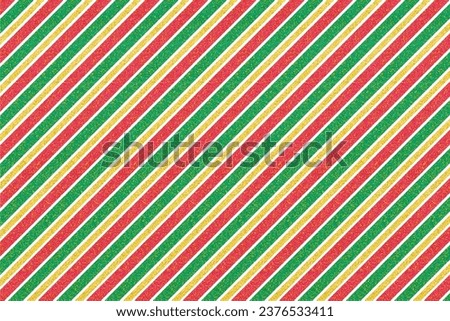 Abstract red, green and golden diagonal stripes. Texture for textile, fashion, paper, packaging, packaging and branding. Suitable as a Christmas background.