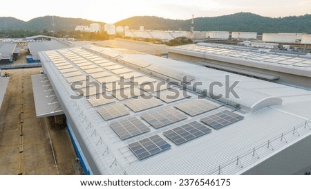 Solar Panels on Warehouse Factory. Solar photo voltaic panels system power or Solar Cell on industrial building roof for producing green ecological electricity. Production of renewable energy. 