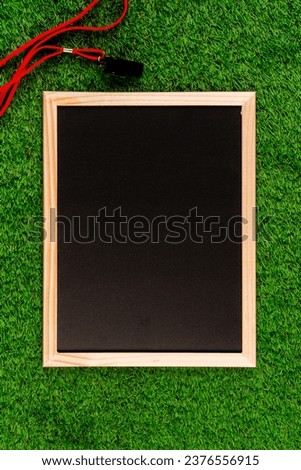 : A photo of a football composition set against a slate background, creating a unique and textured aesthetic