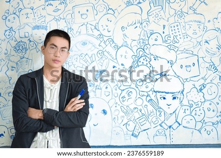 Asian boy holds blue white board pen standing in front of white board which full of his art pen drawing, new edited, art classroom with drawing lesson concept.