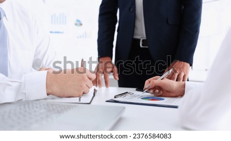 Group of people hold silver pen ready to make note in clipboard pad sheet closeup. Training course university practice homework school or college exercise secretary table management concept Royalty-Free Stock Photo #2376584083