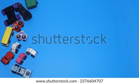 Toys Cars for Kids with negative space on the blue background. The picture is perfect for pamphlets, education posters, education promotion, and mindset development.