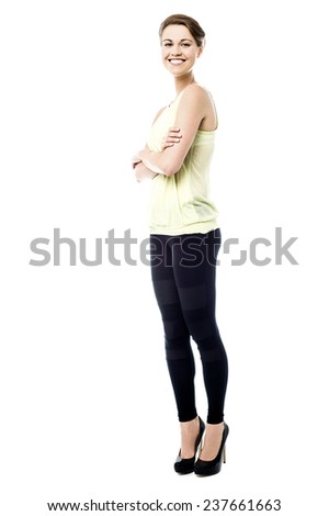 Full length image of woman posing with folded arms