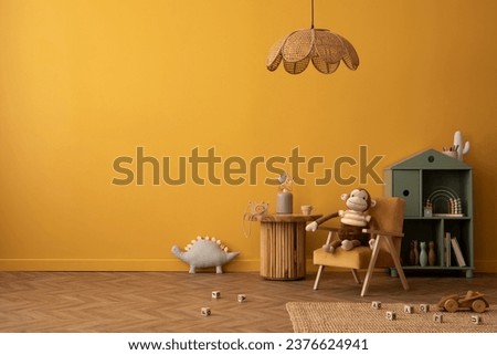 Creative composition of warm and cozy kid room interior with copy space, yellow wall, wooden coffee table, bear carpet, plush toys, children's kitchen and personal accessories. Home decor. Template.