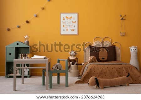 Warm and cozy kid room interior with mock up poster frame, gray desk, chair, braided bed, brown bedding, yellow wall, plush monkey, colorful garland and personal accessories. Home decor. Template.