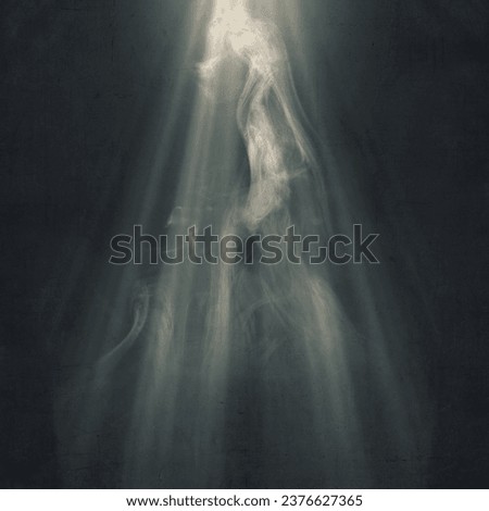 Light with smoke on a dark background. Scary Halloween background concept