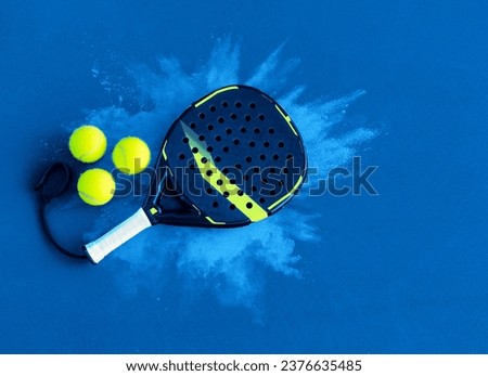 Padel tennis racket. Background with copy space. Sport court and balls.