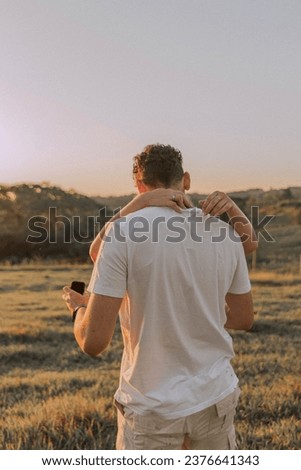 marriage proposal, open photo shoot couple photography in sunset golden hour ; hand tattoo