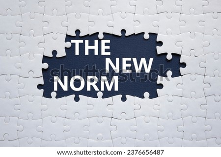 The new norm symbol. Concept words The new norm on white puzzle. Beautiful dark blue background. Business and The new norm concept. Copy space. Royalty-Free Stock Photo #2376656487