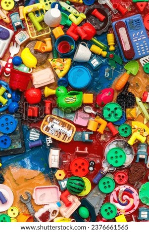 Old plastic children's toys, background, plastic waste recycling.
