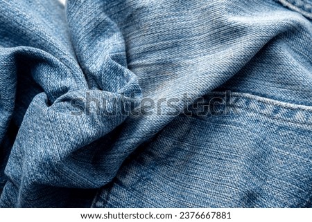 Jeans Fabric Pattern Background: Jeans Background Image Creating a background picture with a fabric pattern for jeans can add a unique and stylish touch to your design. Here's how you can describe the Royalty-Free Stock Photo #2376667881