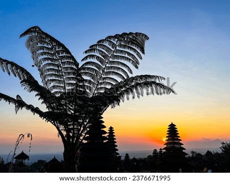 Pura Agung Besakih in Bali, Indonesia, October 2023
Beautiful sunset, Balinese temple, palm tree in the foreground