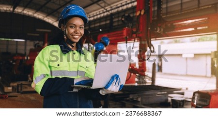 Young female engineers, experts in computer maintenance, are used to create work systems in warehouses and factories. They work together Royalty-Free Stock Photo #2376688367