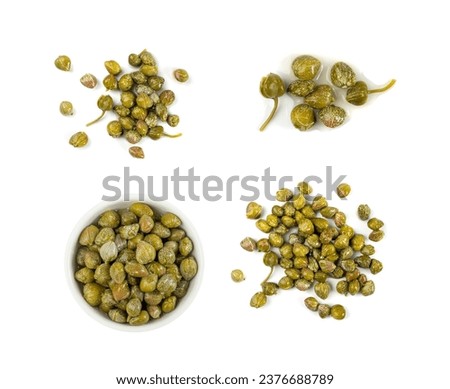 Pickled capers pile isolated. Marinated caper buds, small salted capparis, fermented food, pickled capers group on white background top view Royalty-Free Stock Photo #2376688789