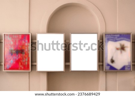 blank white poster and advertising ad space in picture frame. outdoor display and lightbox. base mockup panel. empty display. glass and stainless steel design. stucco exterior wall background.