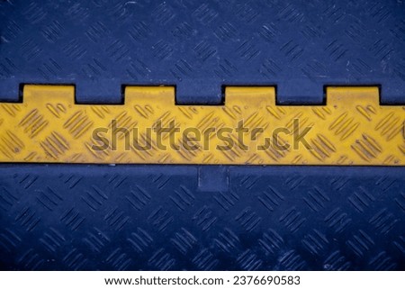 The metal sheet is blue with a yellow stripe with a notch like a lentil. Construction interior background.