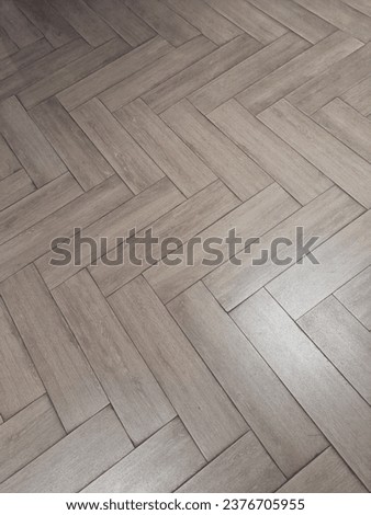 Zig zag rectangle brown wood panel arrangement as pathway and interior design under white bright lamp Royalty-Free Stock Photo #2376705955